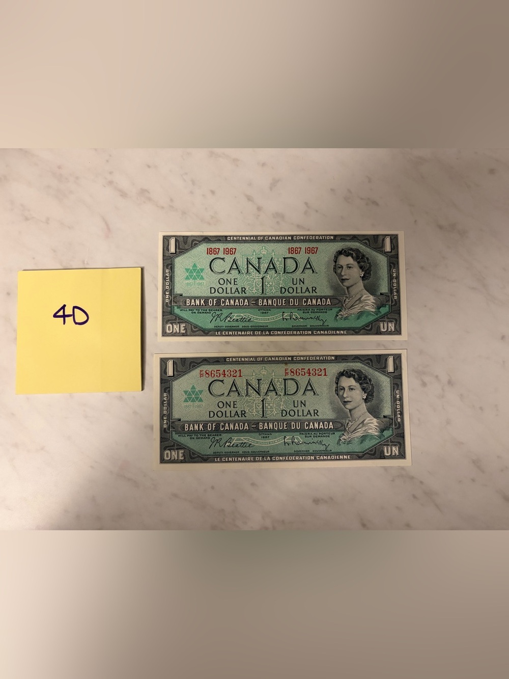 1967 set of 2 - Canada Centennial One Dollar Bills - Green - uncirculated